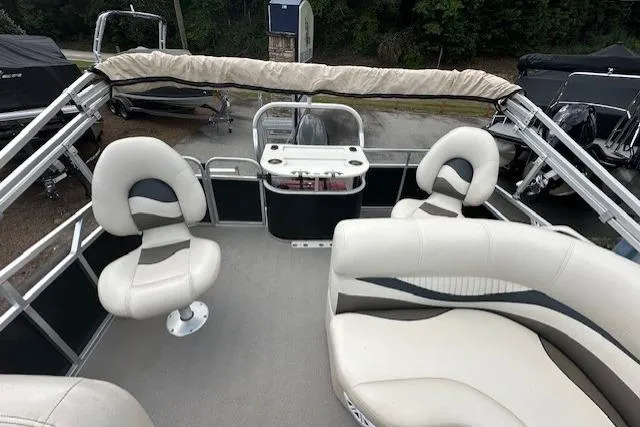 Slide: The Image of 2014 Qwest LS 820 XRE Cruise pontoon boat interior with seating and helm. - 13