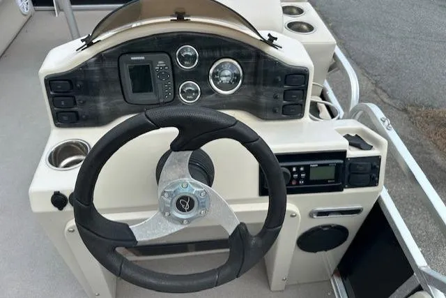 Slide: The Image of Steering console of 2014 Qwest LS 820 XRE Cruise boat with gauges and controls. - 14