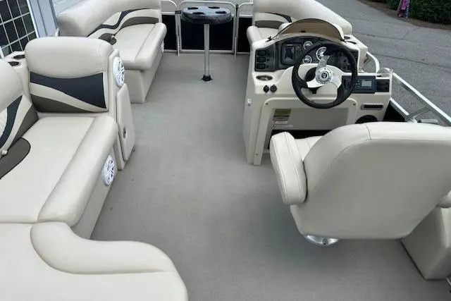 Slide: The Image of Luxurious 2014 Qwest LS 820 XRE Cruise pontoon boat interior with plush seating and modern helm. - 15