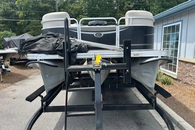 Slide: The Image of 2014 Qwest LS 820 XRE Cruise pontoon boat on trailer, parked outdoors. - 3