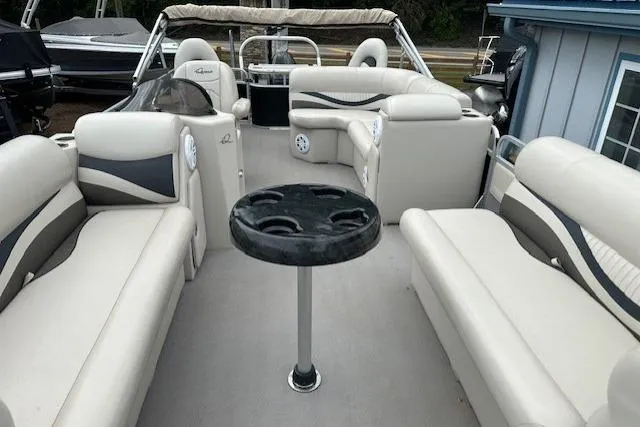 Slide: The Image of 2014 Qwest LS 820 XRE Cruise boat interior with beige seating and central table. - 7