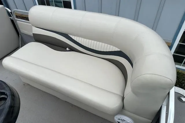 Slide: The Image of 2014 Qwest LS 820 XRE Cruise boat seat with beige upholstery and curved design. - 8