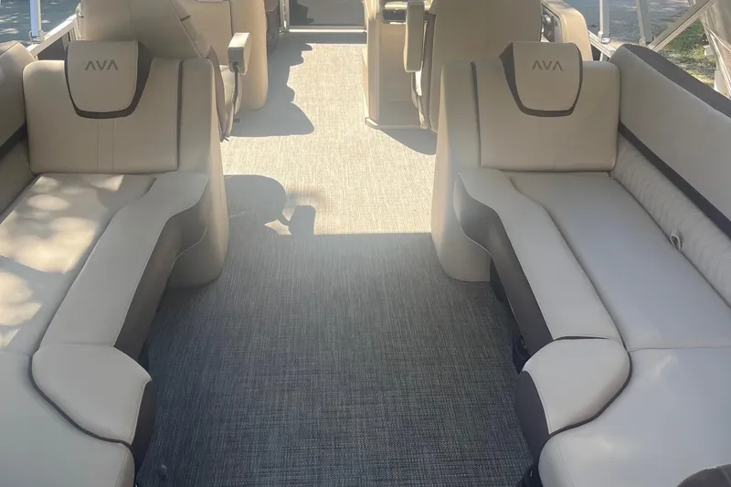 Slide: The Image of 2026 Avalon 25 LSZ Quad Lounger interior with beige seating and spacious layout. - 5