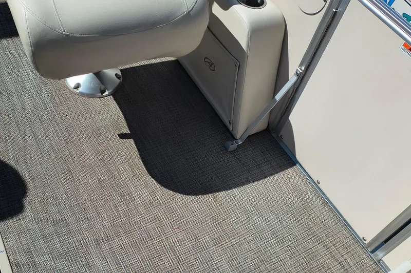 Slide: The Image of 2022 Avalon Catalina Quad Lounge 25 interior with beige seating and textured flooring. - 10