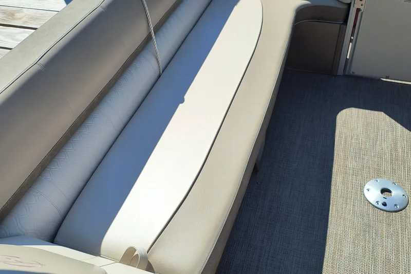 Slide: The Image of 2022 Avalon Catalina Quad Lounge 25 interior seating with beige upholstery. - 17