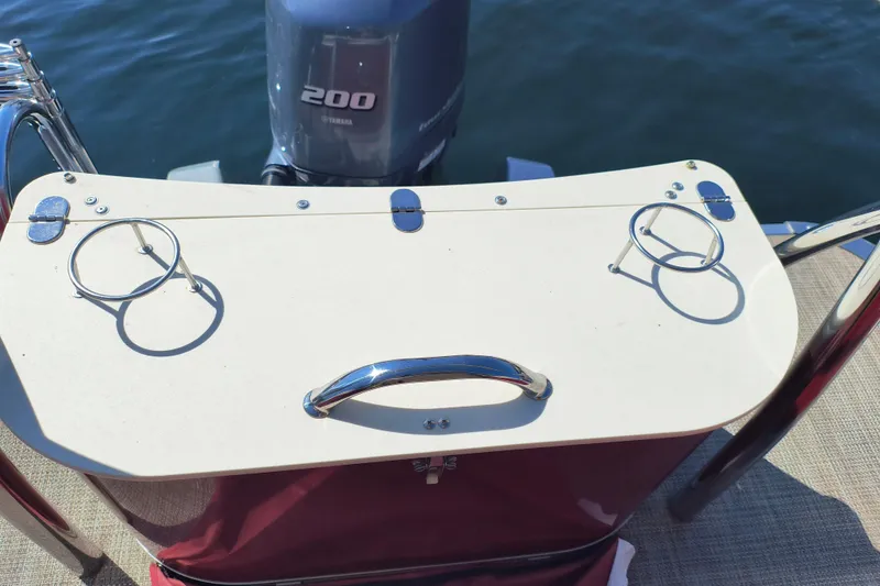 Slide: The Image of 2022 Avalon Catalina Quad Lounge 25 with Yamaha 200 engine, featuring cup holders. - 27