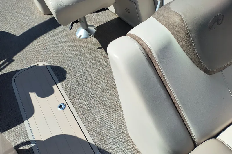 Slide: The Image of 2022 Avalon Catalina Quad Lounge 25 interior with beige seating and flooring. - 9