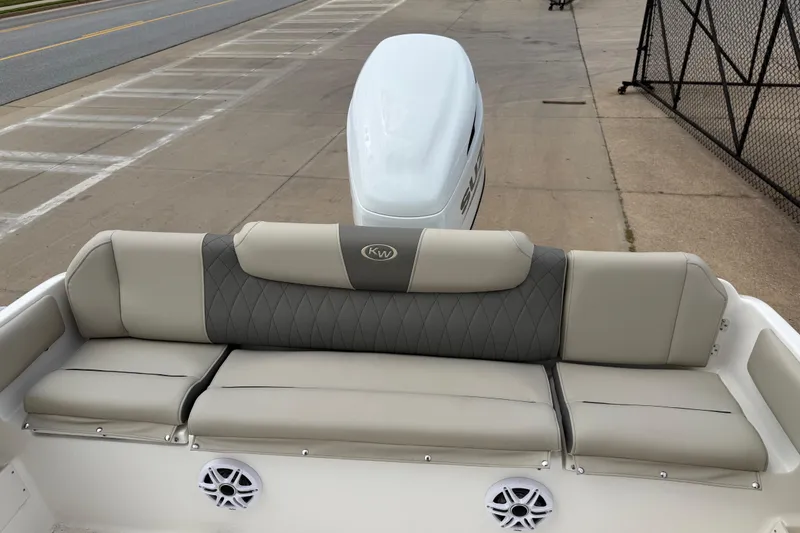 Slide: The Image of 2026 Key West 239 FS boat with cushioned seating and sleek design. - 11