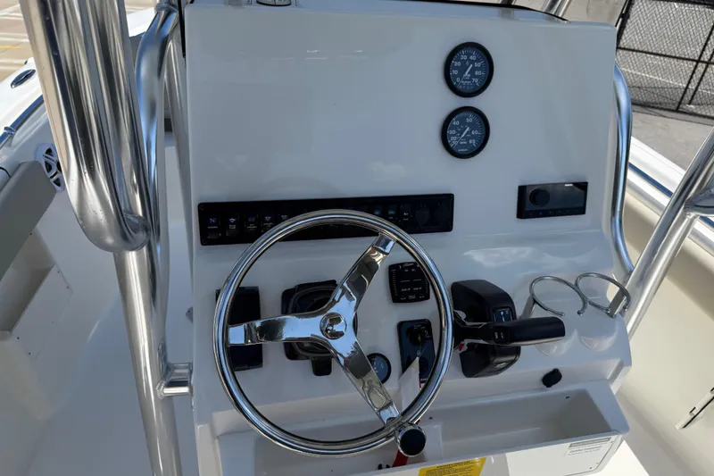 Slide: The Image of 2026 Key West 239 FS boat dashboard with steering wheel and control panel. - 20