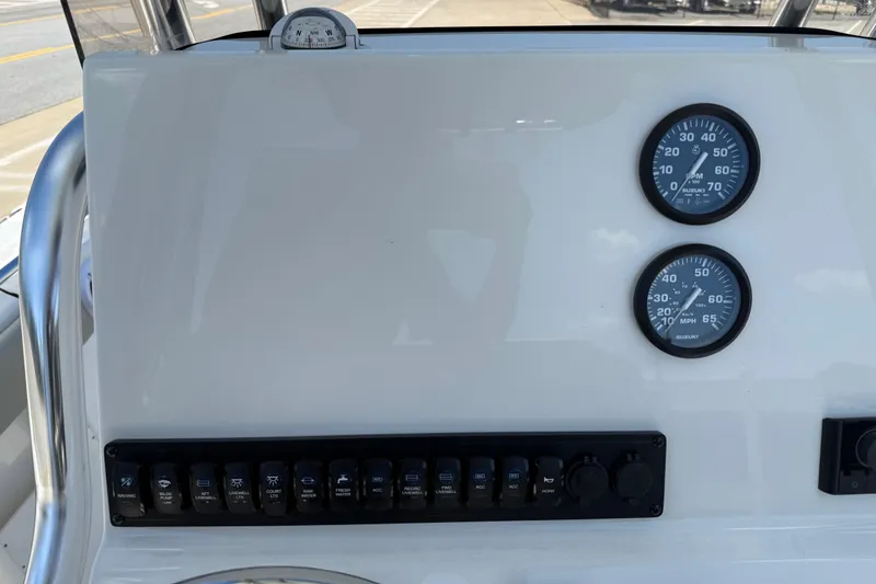 Slide: The Image of Dashboard of 2026 Key West 239 FS boat with gauges and switches. - 21