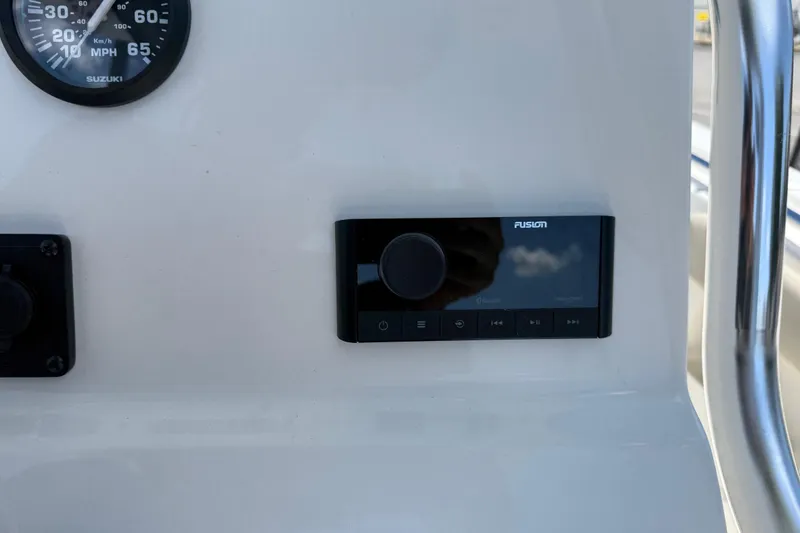 Slide: The Image of Control panel of 2026 Key West 239 FS boat with speedometer and audio system. - 22
