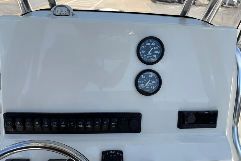 Slide: The Image of Dashboard of 2026 Key West 239 FS boat with gauges and controls. - 23