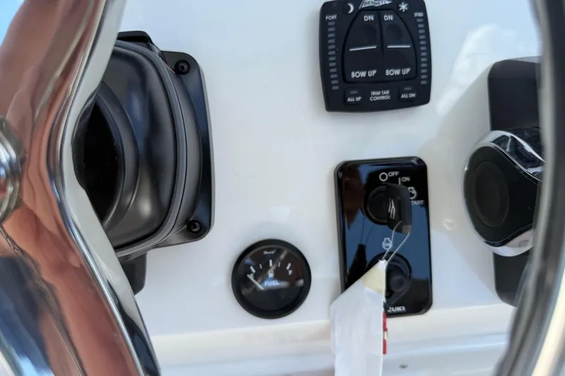 Slide: The Image of Control panel of 2026 Key West 239 FS boat with steering wheel and gauges. - 24