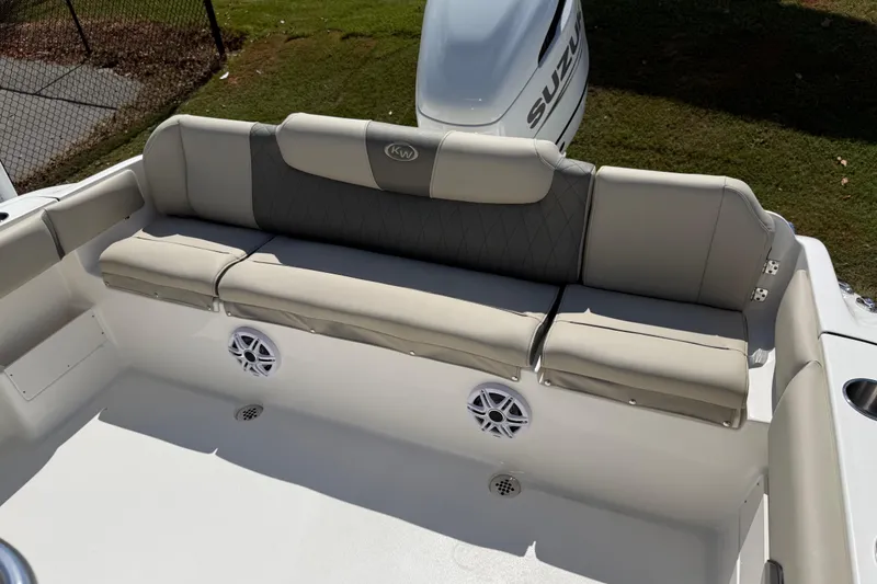 Slide: The Image of 2026 Key West 239 FS boat interior with cushioned seating and speaker system. - 28