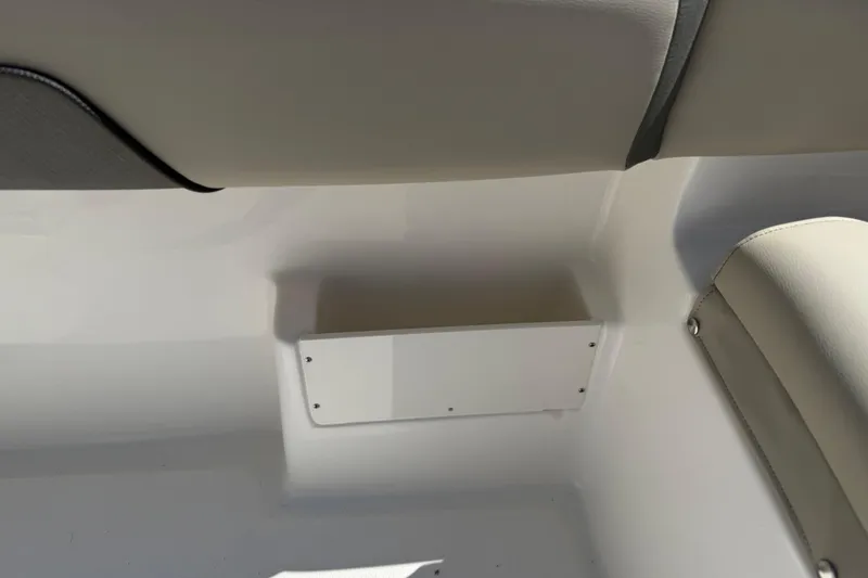 Slide: The Image of Interior detail of 2026 Key West 239 FS boat, featuring seating and storage area. - 29