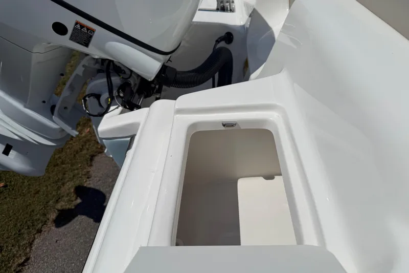 Slide: The Image of Key West 239 FS 2026 boat engine compartment with storage area, close-up view. - 42