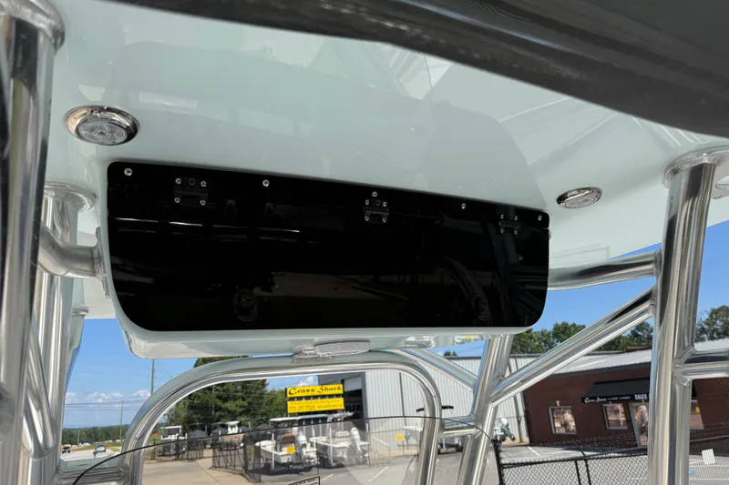 Slide: The Image of 2026 Key West 239 FS boat console with stainless steel frame and electronics panel. - 44