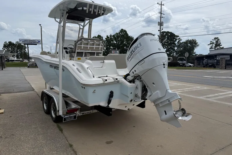 Slide: The Image of 2026 Key West 239 FS boat with Suzuki outboard motor on a trailer. - 6