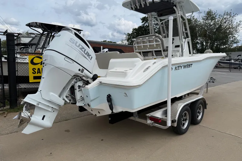 Slide: The Image of 2026 Key West 239 FS boat with Suzuki outboard motor on a trailer. - 8