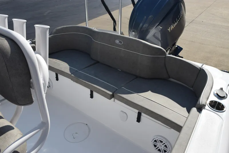 Slide: The Image of 2026 Sea Hunt Ultra 229 boat interior with cushioned seating and Yamaha engine. - 10