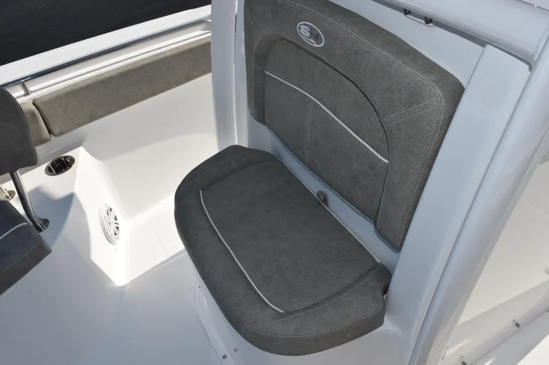 Slide: The Image of 2026 Sea Hunt Ultra 229 boat seat with gray upholstery and sleek design. - 12