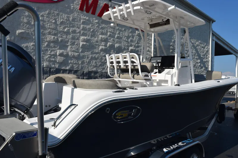 Slide: The Image of 2026 Sea Hunt Ultra 229 boat with Yamaha engine, displayed outdoors. - 4