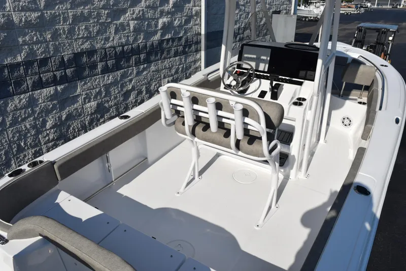 Slide: The Image of 2026 Sea Hunt Ultra 229 boat interior with helm and seating. - 7