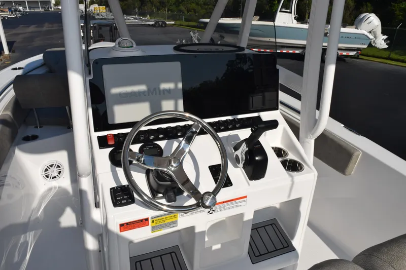 Slide: The Image of 2026 Sea Hunt Ultra 229 boat console with Garmin display and steering wheel. - 8