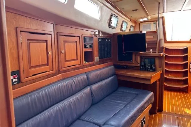 Slide: The Image of Interior of 2004 Saga 43CLS yacht with wooden cabinetry and blue seating. - 3