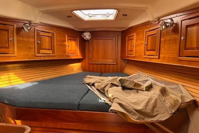 Slide: The Image of Cozy cabin interior of 2004 Saga 43CLS yacht with wooden finish and skylight. - 9
