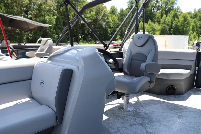 Slide: The Image of 2025 Flagship Freedom 20 CU Tritoon interior with plush seating and modern design. - 4