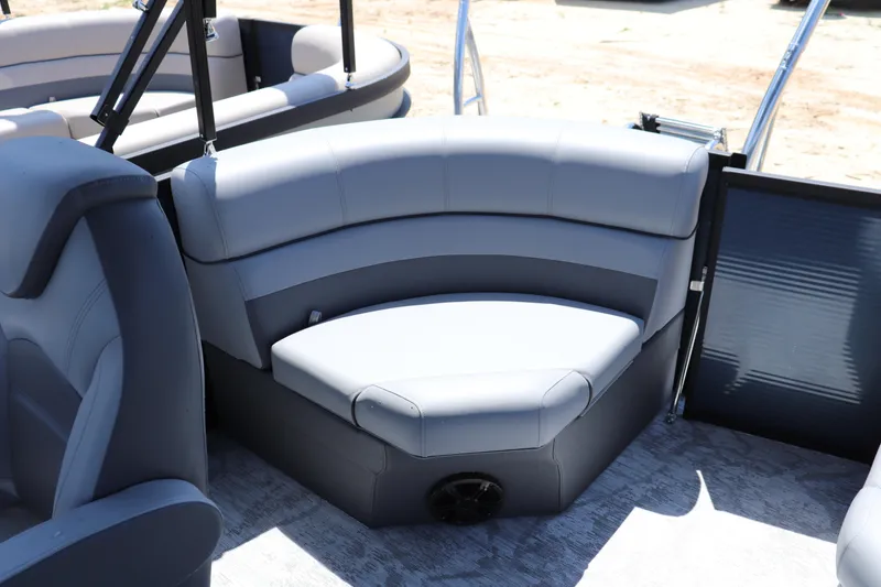 Slide: The Image of Luxurious seating on 2025 Flagship Freedom 20 CU Tritoon boat, featuring sleek gray upholstery. - 7