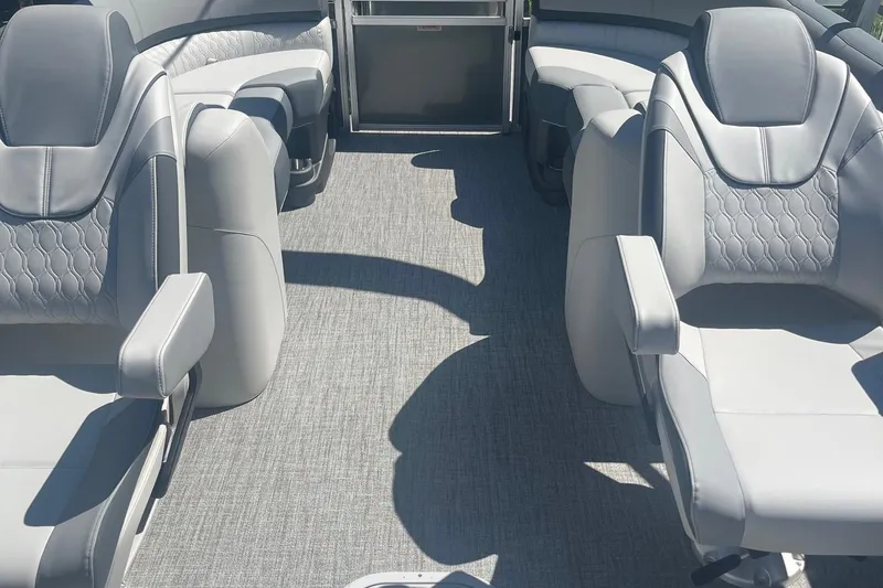 Slide: The Image of Luxurious seating on 2026 Avalon 23 Quad Lounger boat, featuring elegant gray upholstery. - 4