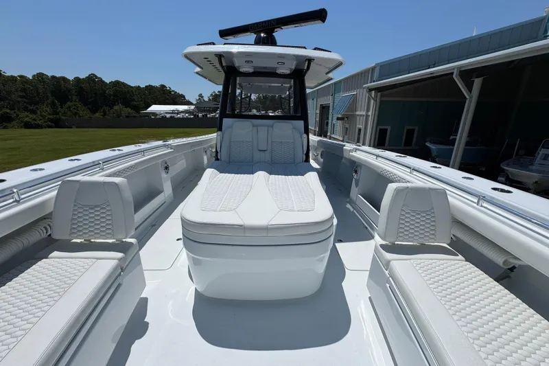 Slide: The Image of Luxurious 2026 Invincible 46 Catamaran with sleek white seating and modern design. - 19