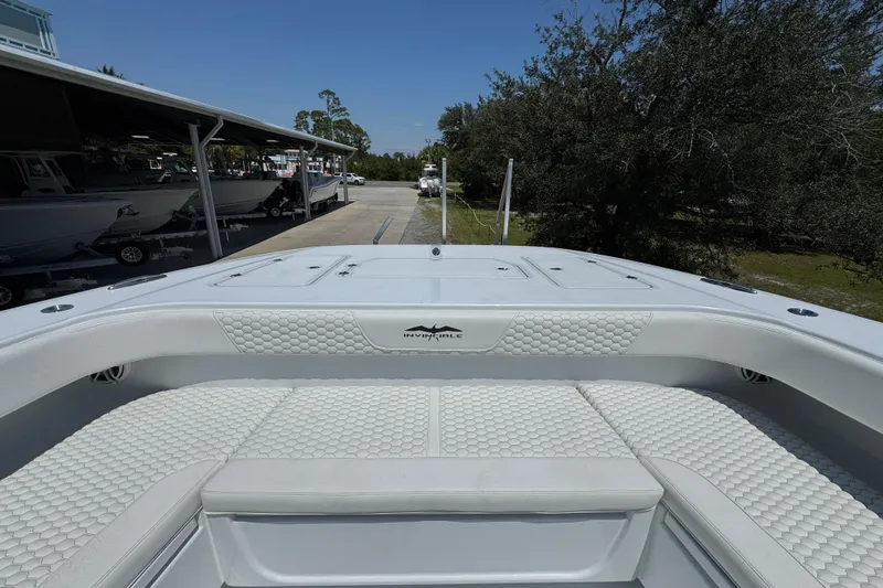 Slide: The Image of Invincible 46 Catamaran 2026, featuring luxurious white seating and sleek design. - 22