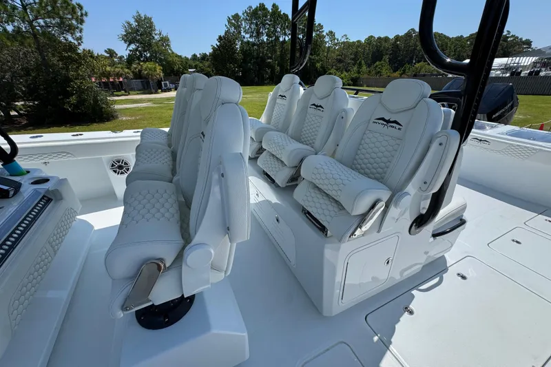 Slide: The Image of Luxurious seating on 2026 Invincible 46 Catamaran, featuring plush white upholstery and modern design. - 27