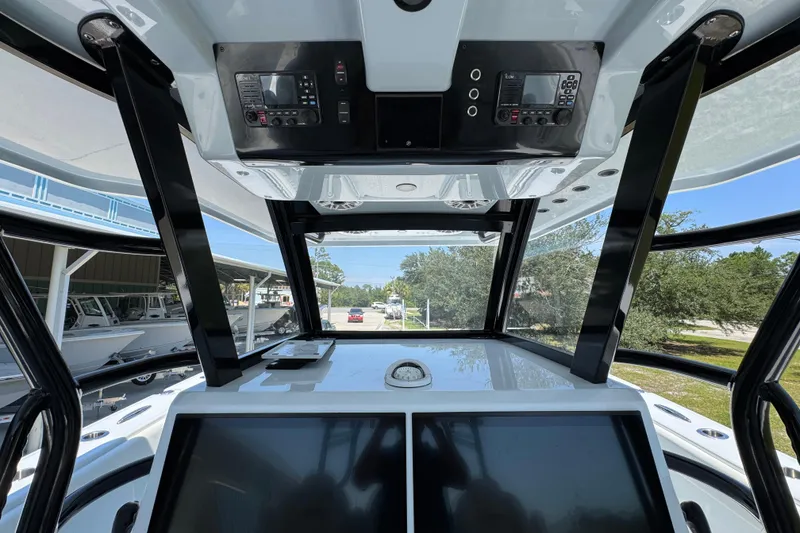 Slide: The Image of Interior view of 2026 Invincible 46 Catamaran cockpit with advanced navigation controls. - 32