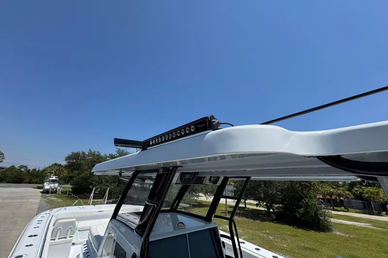 Slide: The Image of 2026 Invincible 46 Catamaran with sleek design and advanced features under clear blue sky. - 37