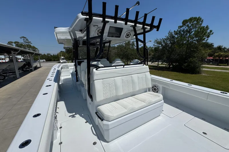 Slide: The Image of 2026 Invincible 46 Catamaran with sleek white seating and modern design features. - 38