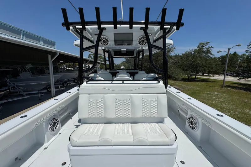 Slide: The Image of 2026 Invincible 46 Catamaran with luxurious seating and modern design under clear skies. - 39