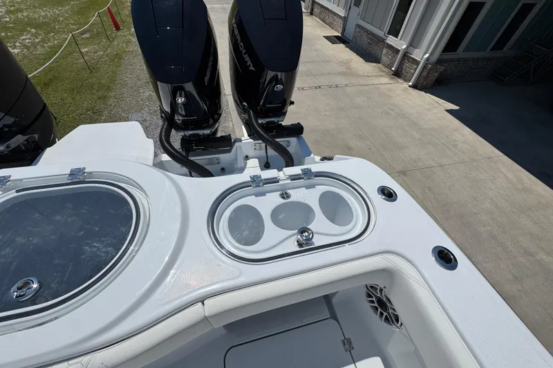 Slide: The Image of 2026 Invincible 46 Catamaran with dual Mercury engines and livewell on deck. - 46