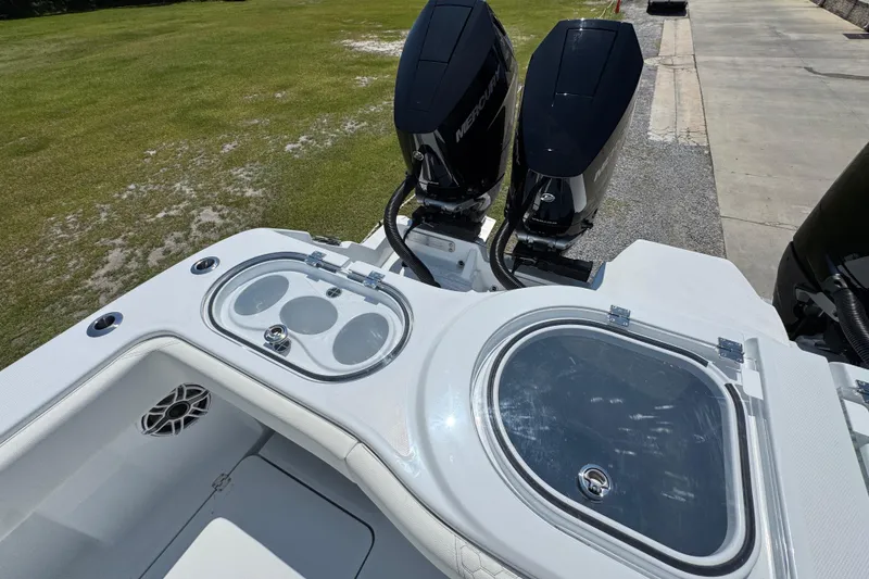 Slide: The Image of 2026 Invincible 46 Catamaran with dual Mercury outboard engines and sleek deck design. - 47