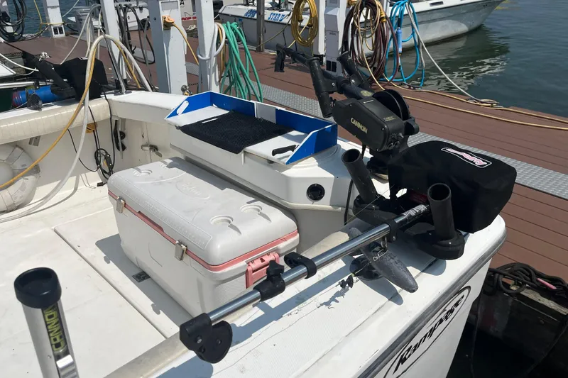 Slide: The Image of 2001 Rampage Express 30 Open boat deck with fishing gear and cooler. - 14