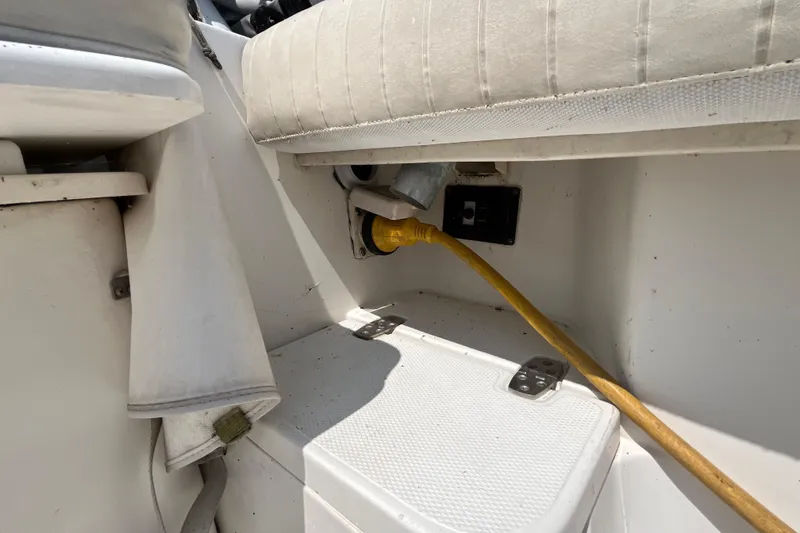 Slide: The Image of 2001 Rampage Express 30 Open boat interior with yellow power cable connection. - 19