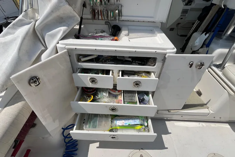 Slide: The Image of 2001 Rampage Express 30 Open boat with open storage drawers and fishing gear. - 24