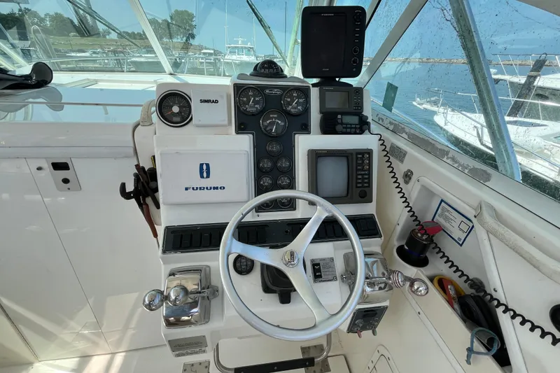 Slide: The Image of Control panel of a 2001 Rampage Express 30 Open boat with navigation equipment. - 29