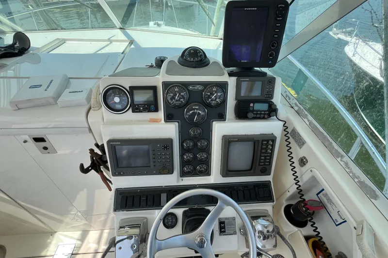 Slide: The Image of 2001 Rampage Express 30 Open boat dashboard with navigation instruments and controls. - 31