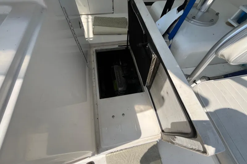 Slide: The Image of Open hatch on 2001 Rampage Express 30 Open boat, revealing storage compartment. - 32