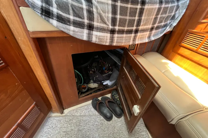 Slide: The Image of Interior of 2001 Rampage Express 30 Open with open storage compartment and shoes. - 45