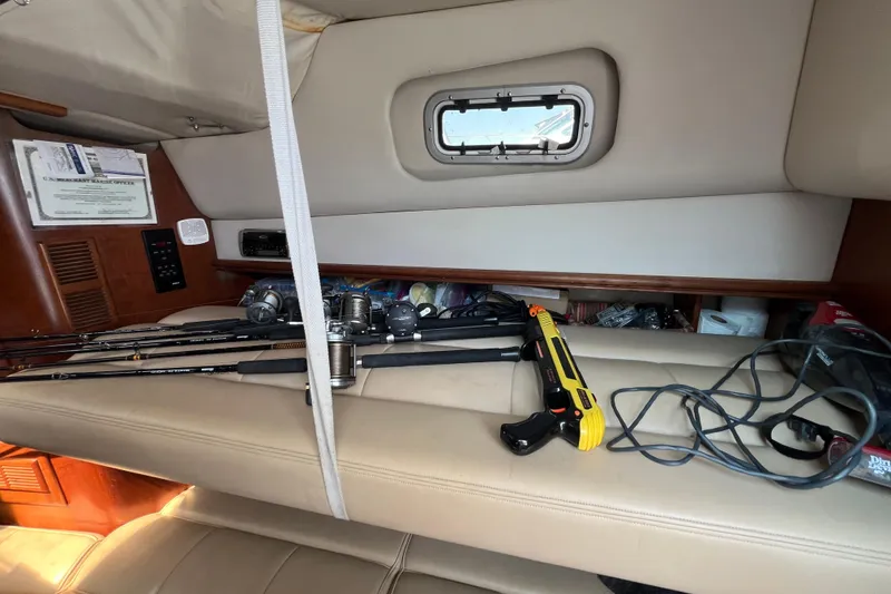 Slide: The Image of Interior of 2001 Rampage Express 30 Open with fishing gear and equipment. - 54